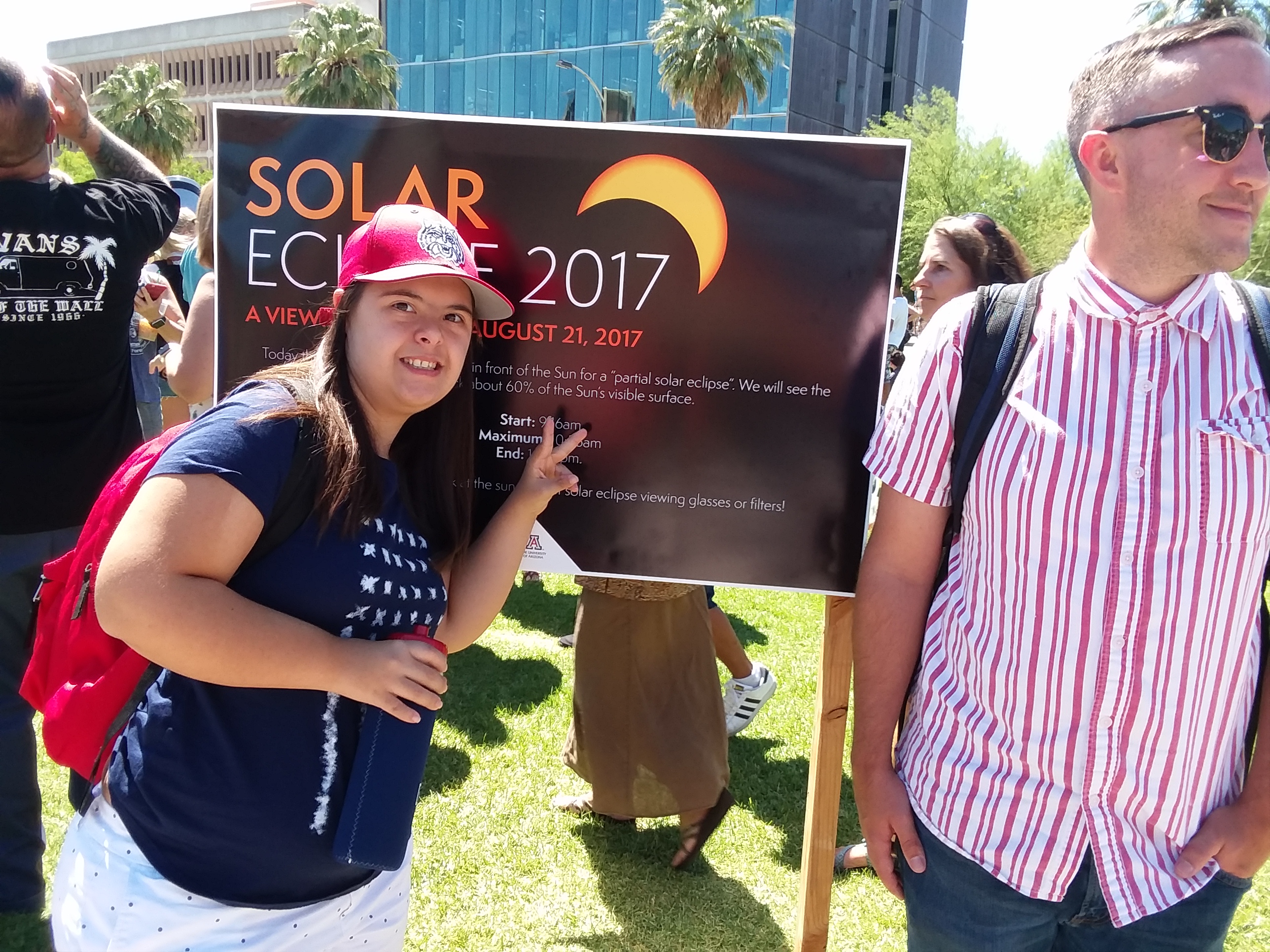 female student and male peer mentor attending 2017 solar eclipse event on campus mall