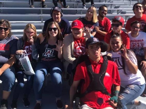 group of students and peer mentors at a football game