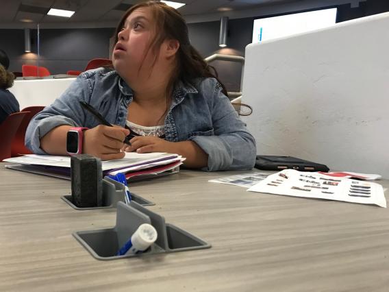 female student at desk in class